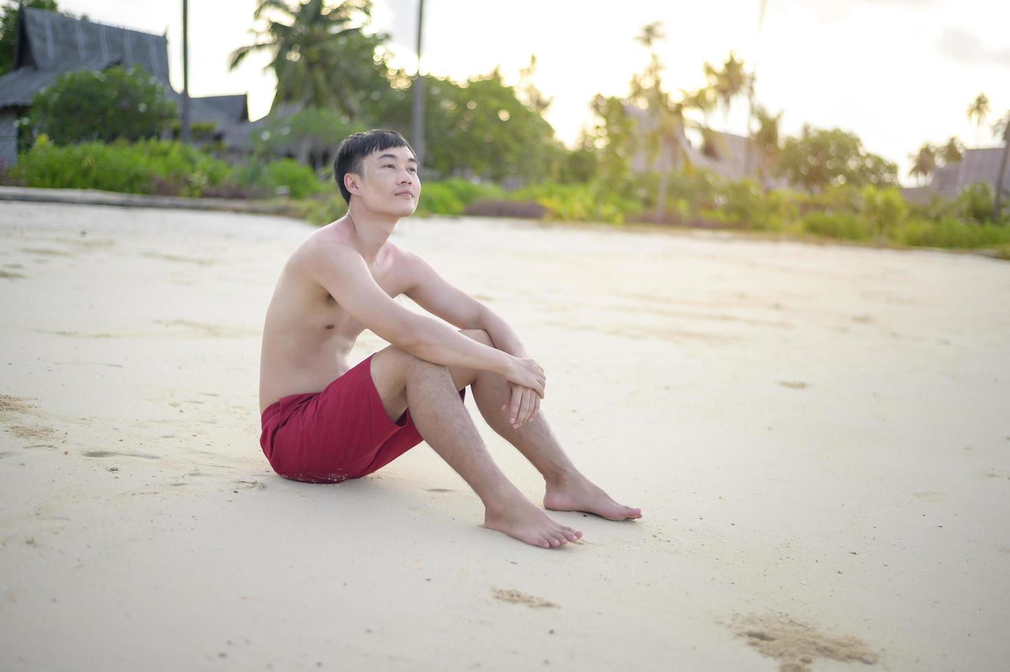 happy man enjoying and relaxing on the beach, Summer and holidays concept photo