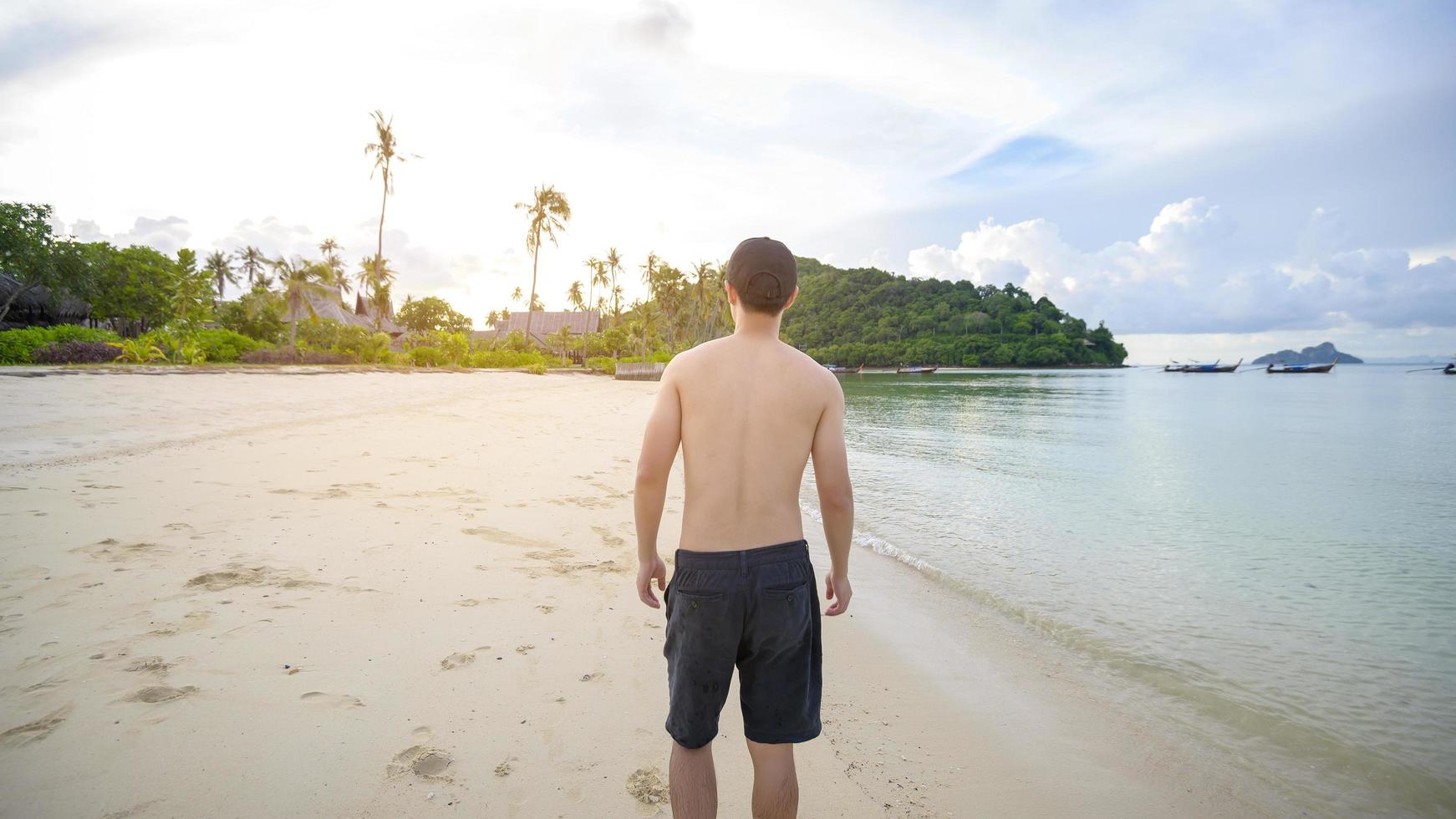 happy man enjoying and relaxing on the beach, Summer and holidays concept photo