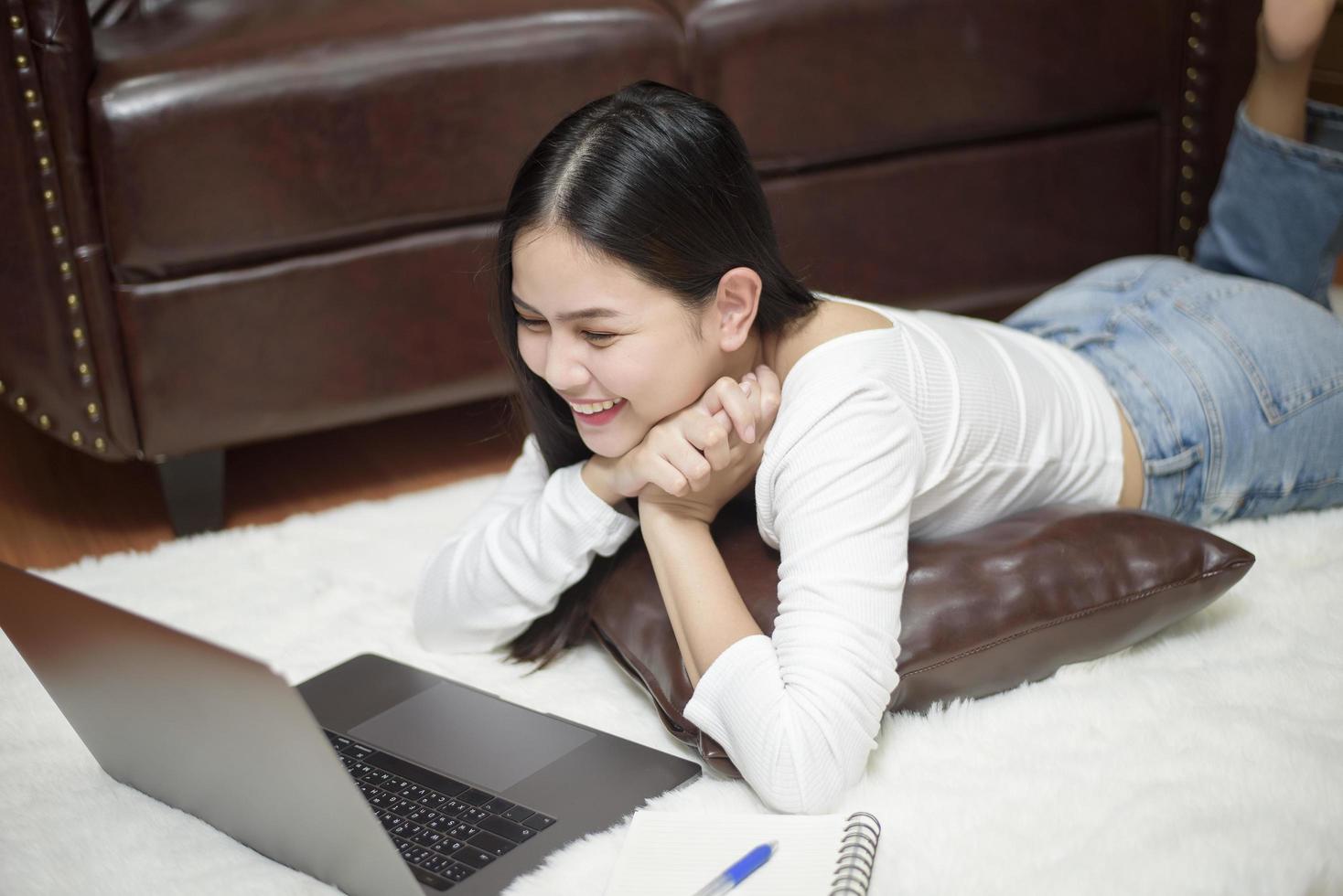 Beautiful woman is working from home photo