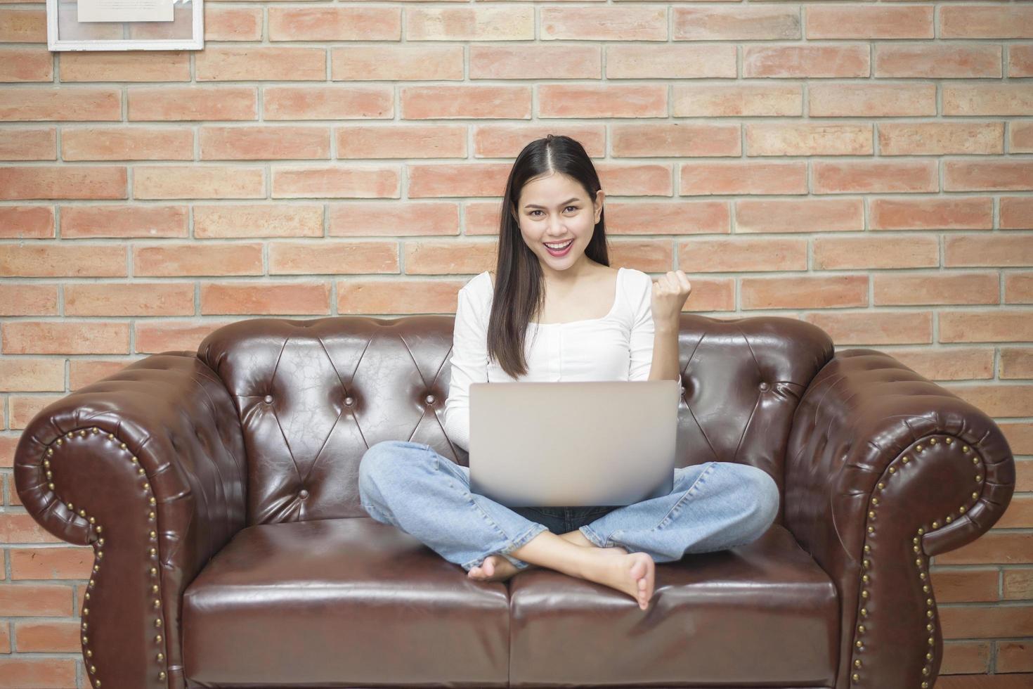 Beautiful woman is working from home photo