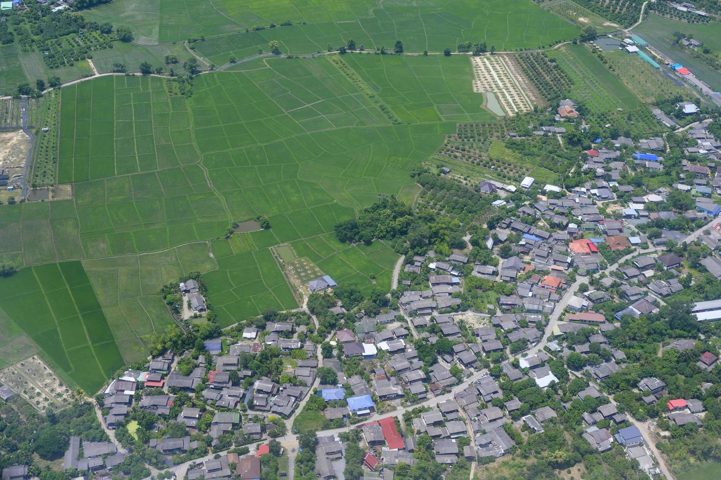 Aerial view photo from airplane of city and clear sky.