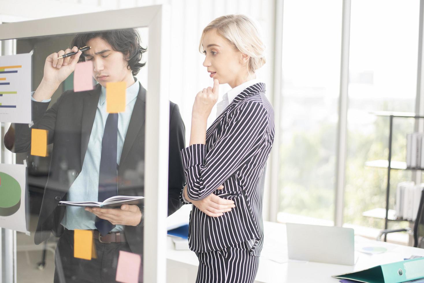 Business people are analyzing financial report photo