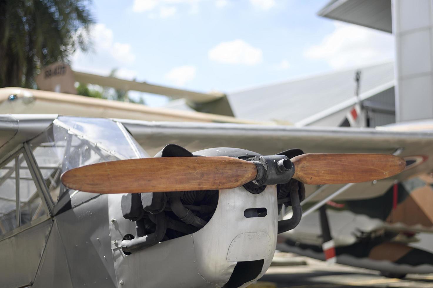 A small plane propeller in an airfield photo