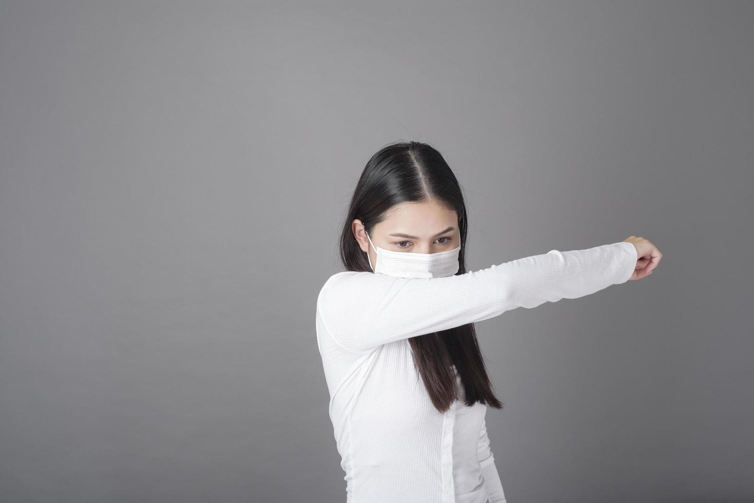 Portrait of woman with surgical mask  in studio, Health care concept photo