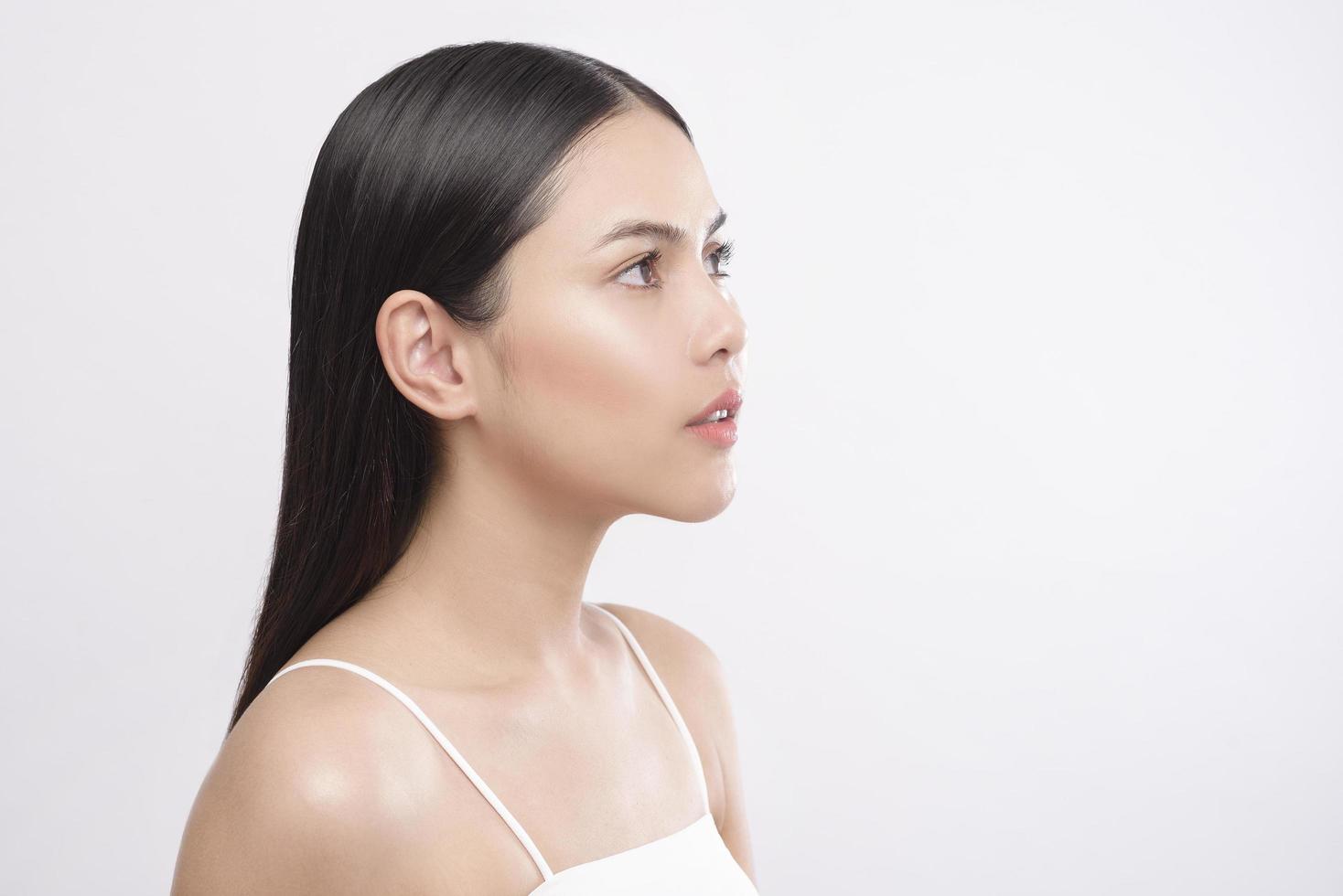 Portrait of young beautiful woman with smooth healthy skin on white background , Skincare concept photo