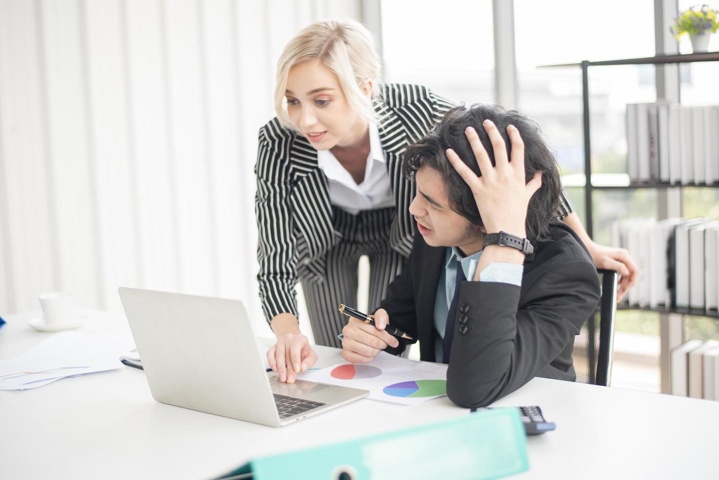 Business people are analyzing financial report photo