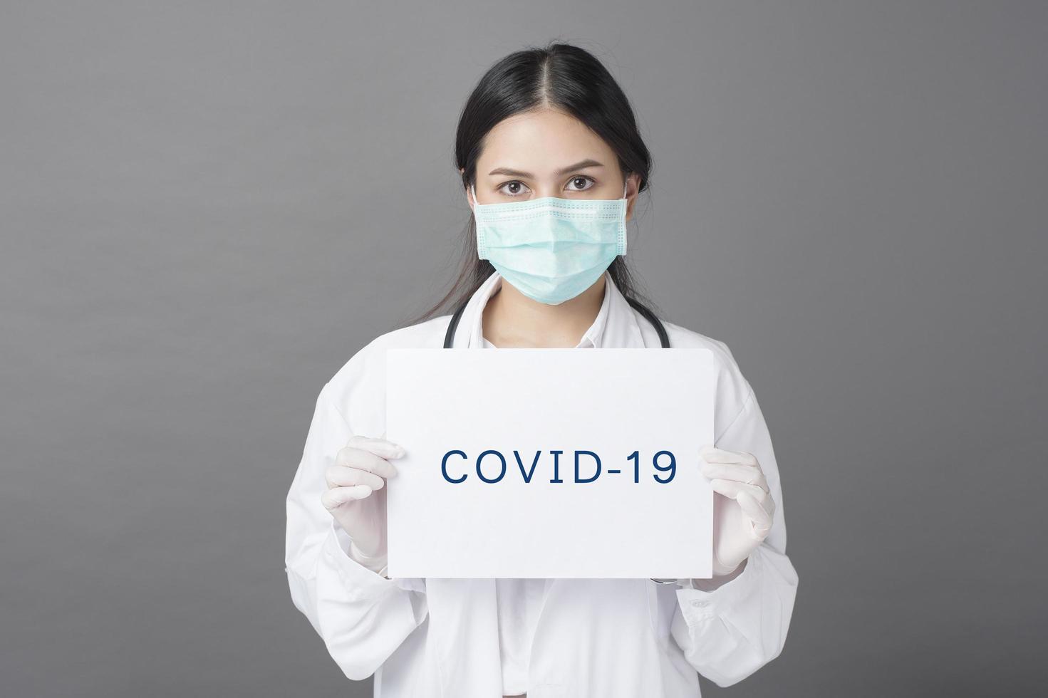 Doctor is holding Coronavirus paper photo