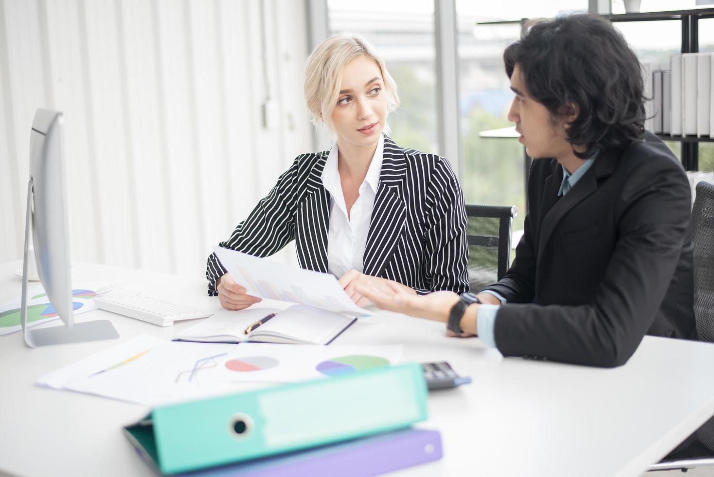 Business people are analyzing financial report photo