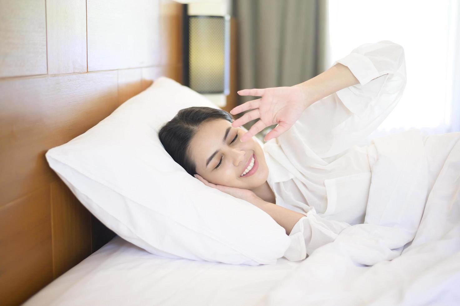 Young beautiful woman sleeping in her bed at home photo