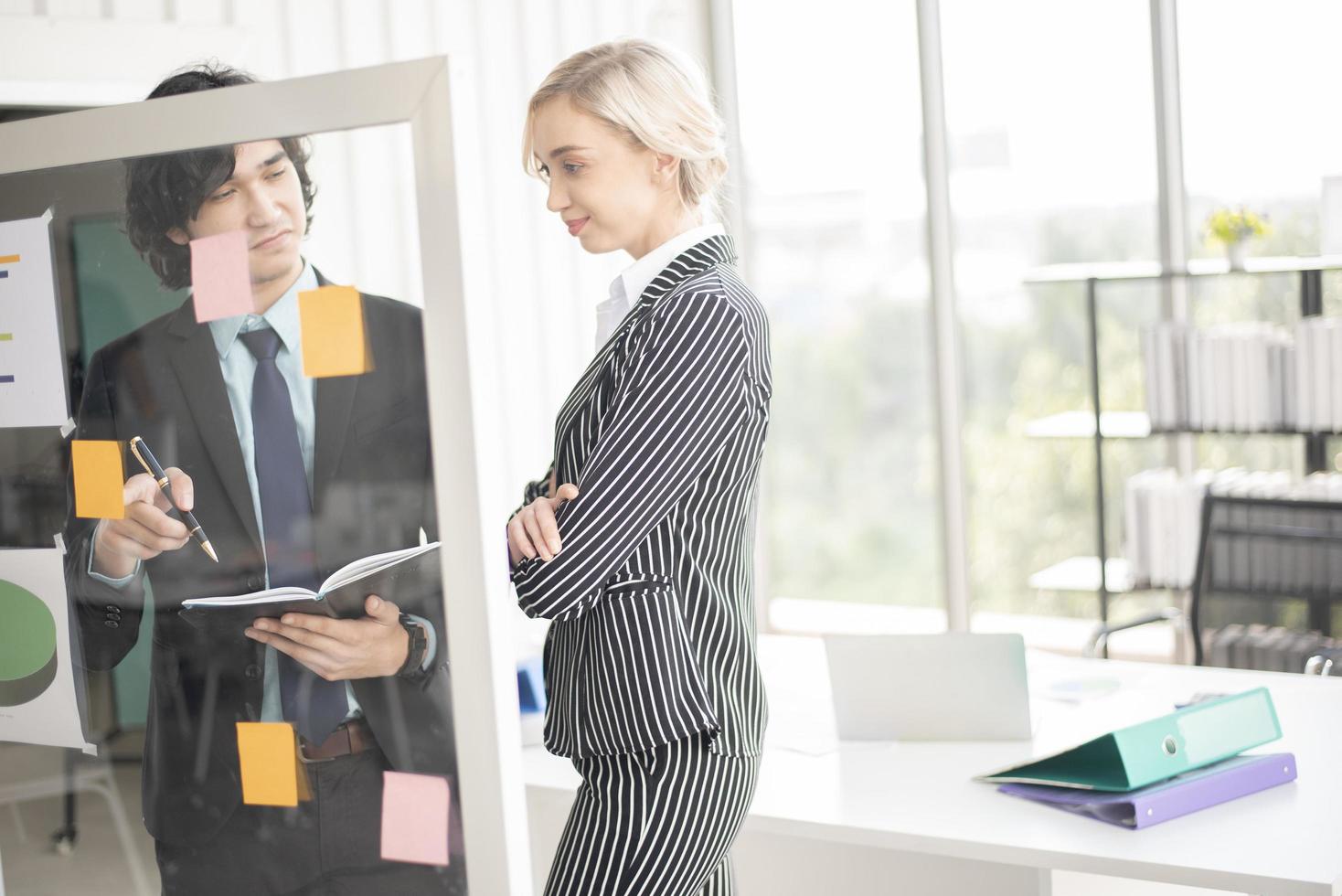 Business people are analyzing financial report photo