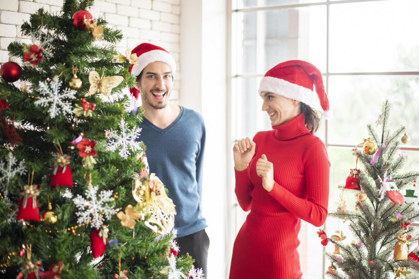 Attractive Caucasian couple of love are  celebrating Christmas in home photo