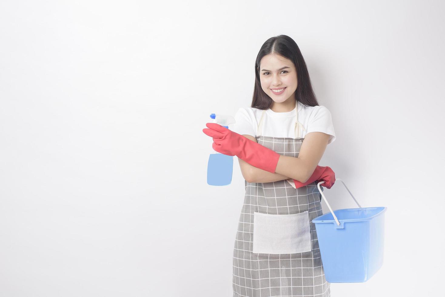 Beautiful woman housekeeper portrait on white background photo