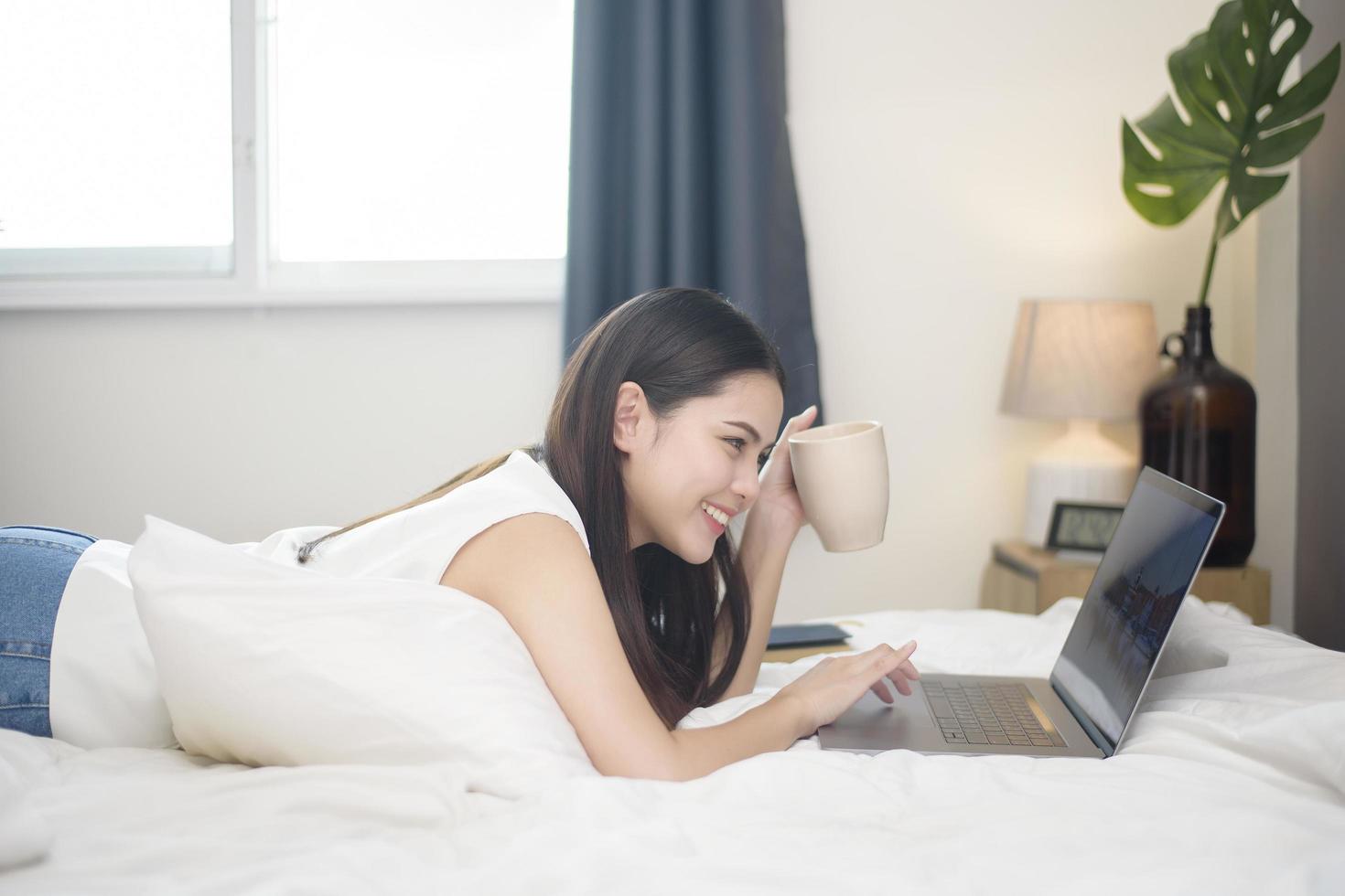 Beautiful woman is working from home photo