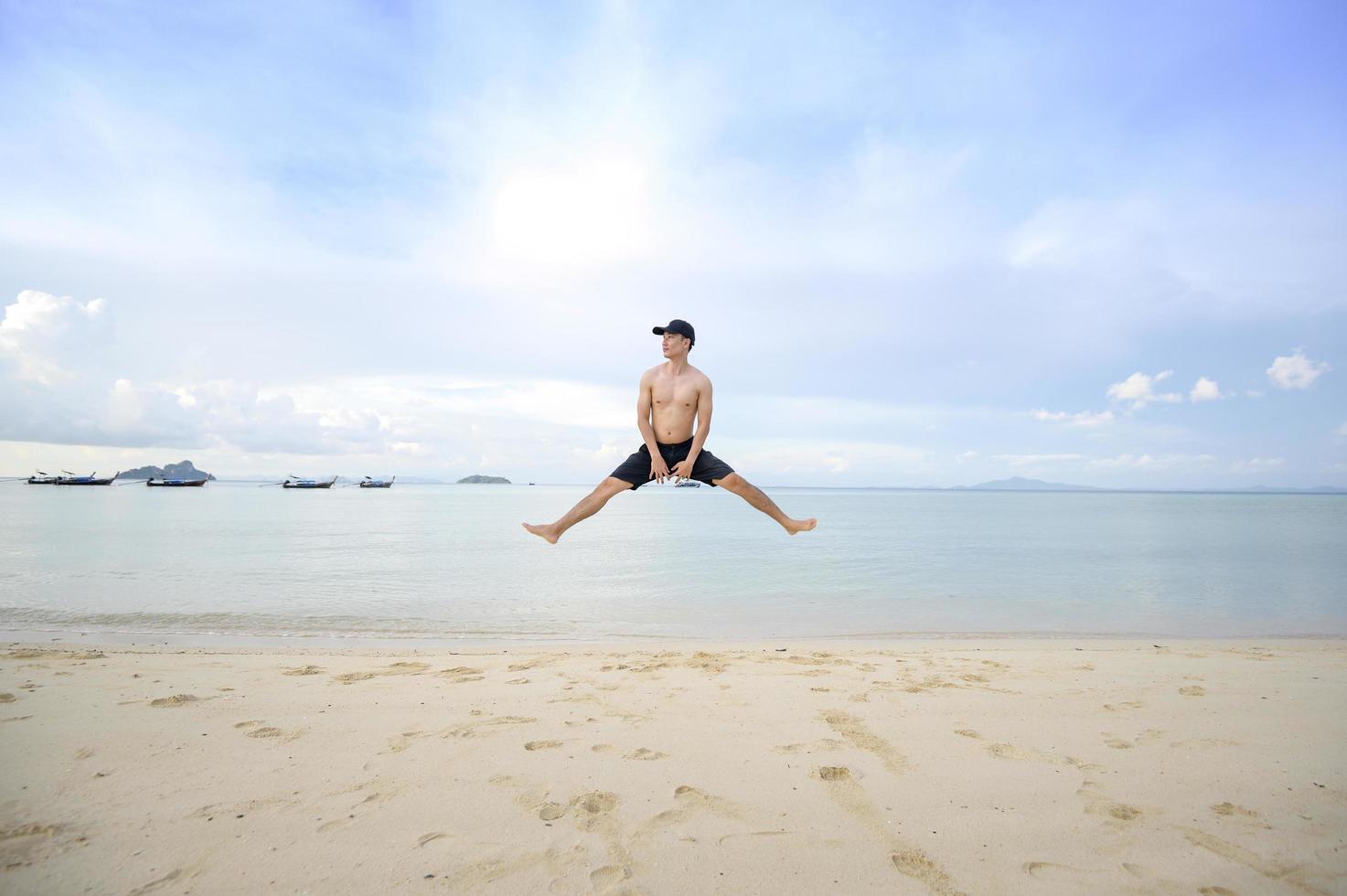 happy man enjoying and relaxing on the beach, Summer and holidays concept photo