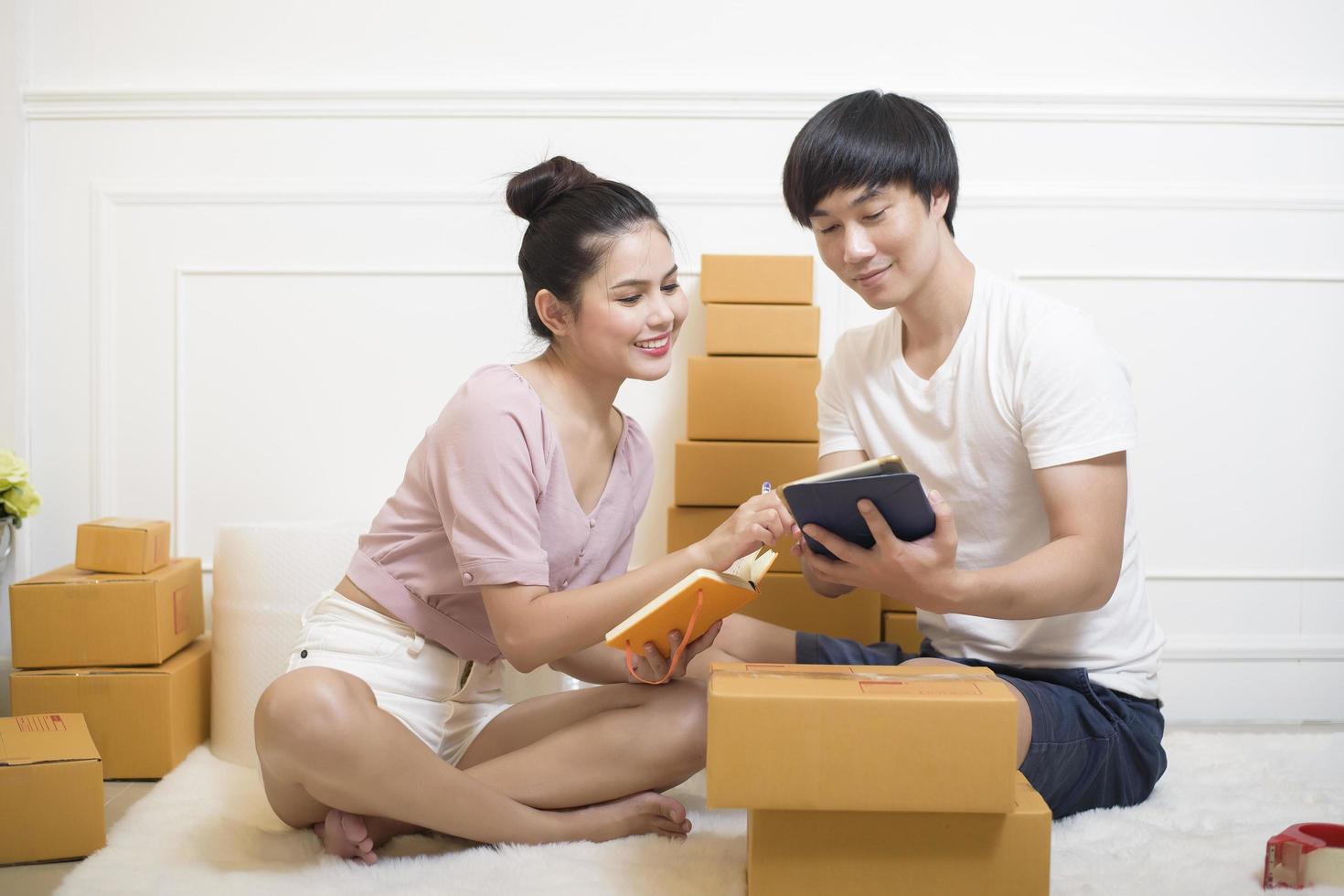 People are preparing products with cardboard boxes for shipping photo