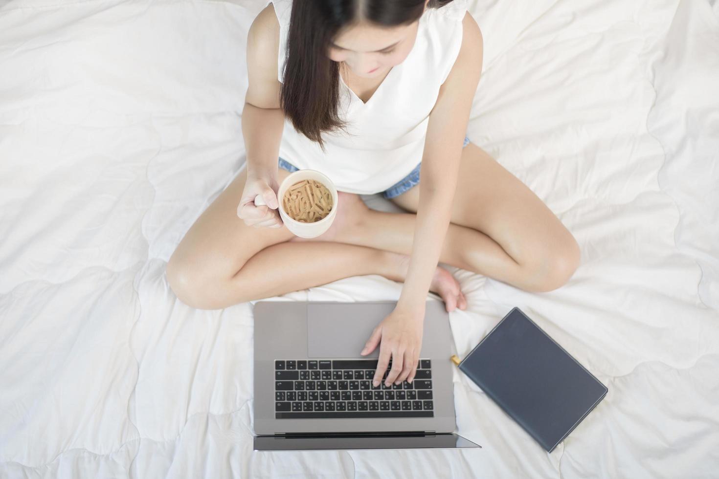 Beautiful woman is working from home photo