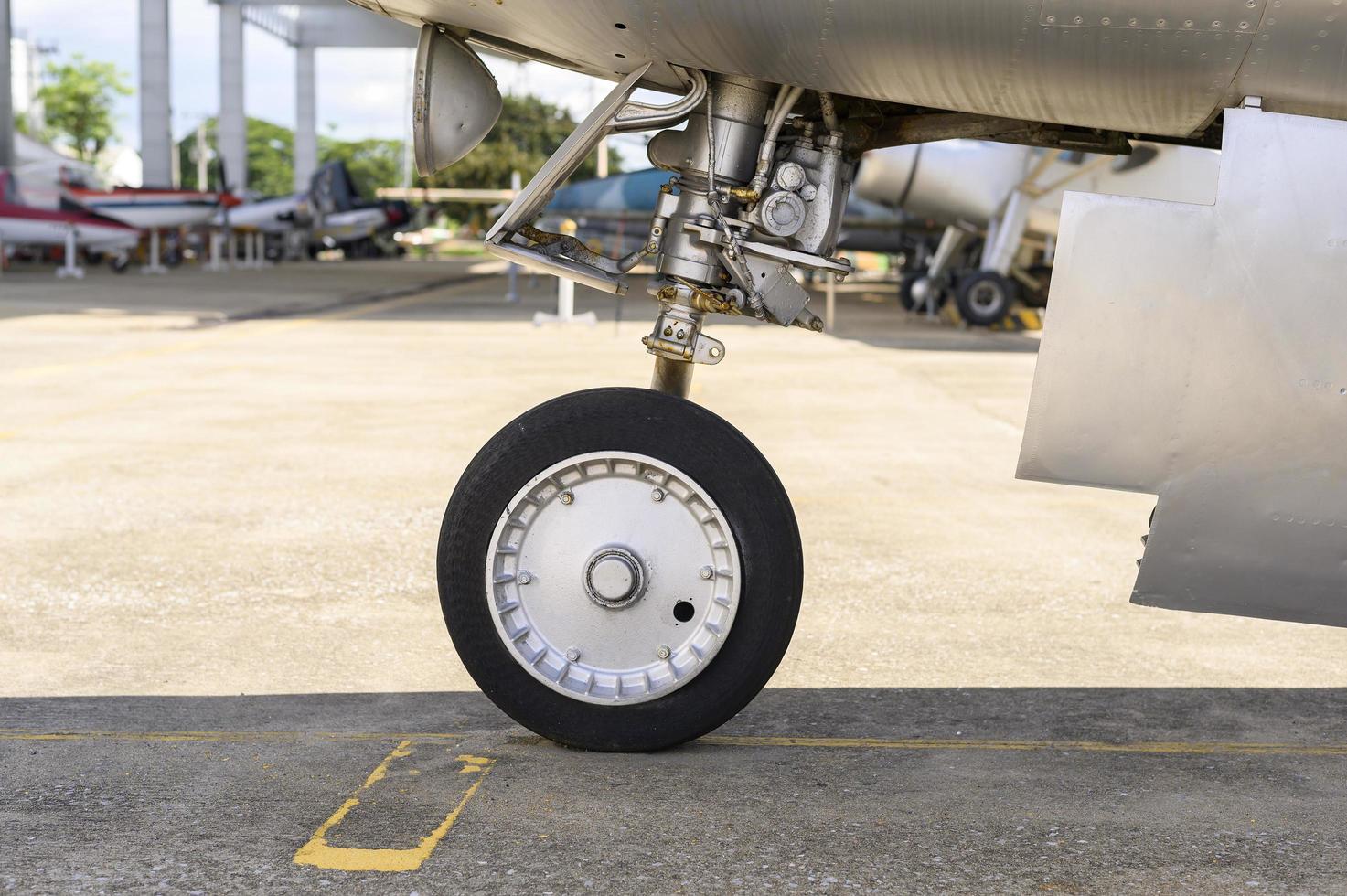 Close up of airplane wheel in an airfield photo