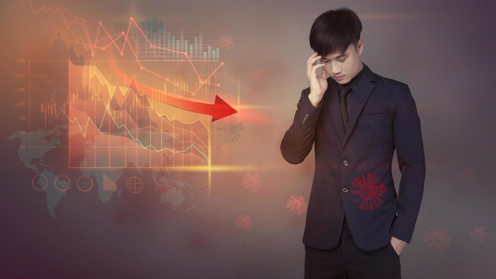 Businessman is analyzing economic data falling due to the coronavirus Covid19 pandemic crisis, World Economic crisis concept photo