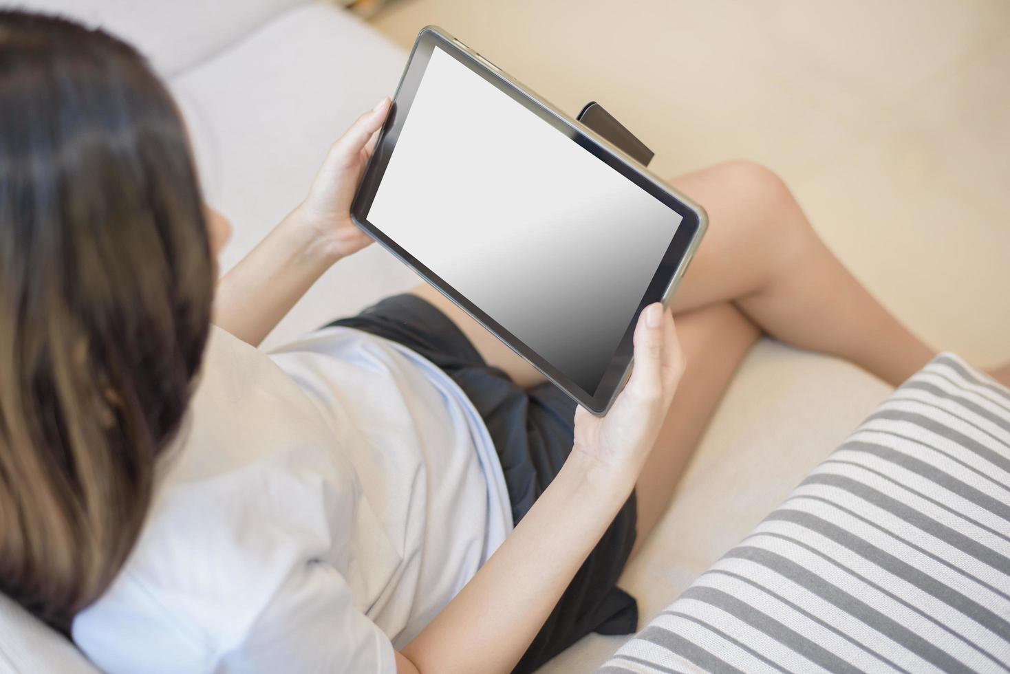 Tablet monitor view mockup over girl shoulders at home photo