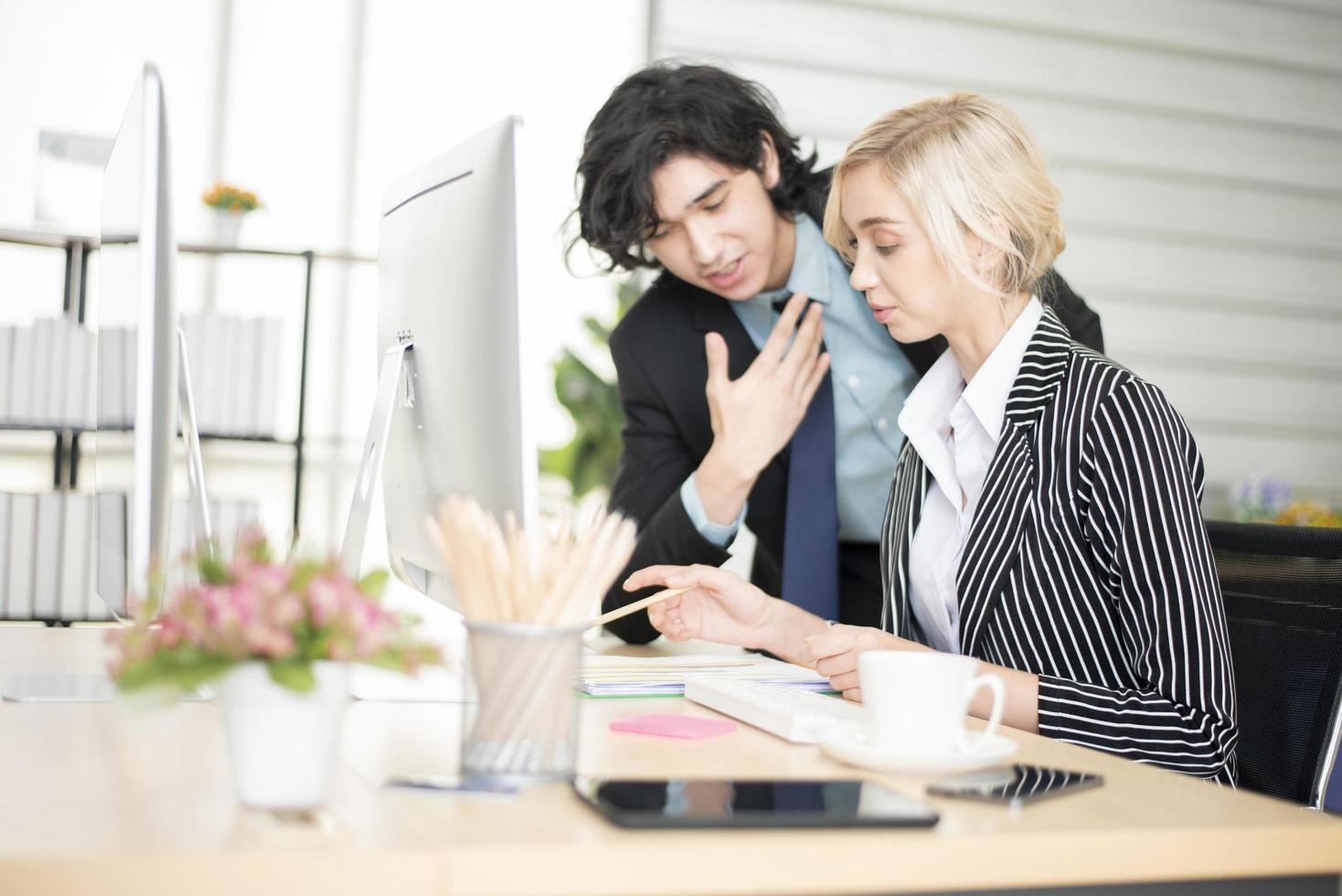 Business people are analyzing financial report photo