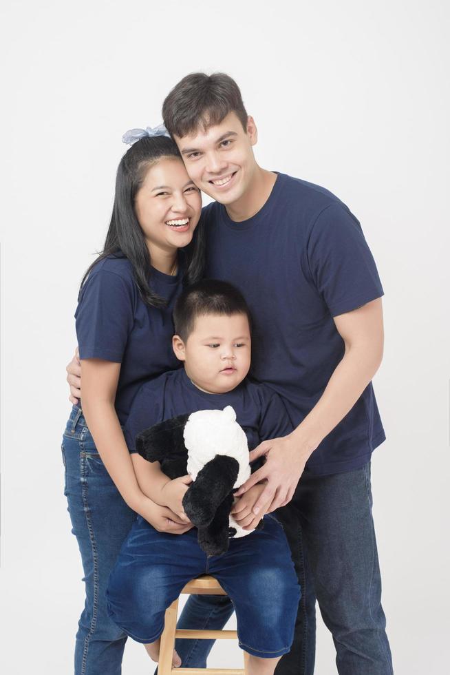 Happy Asian family are enjoy with  son in studio photo