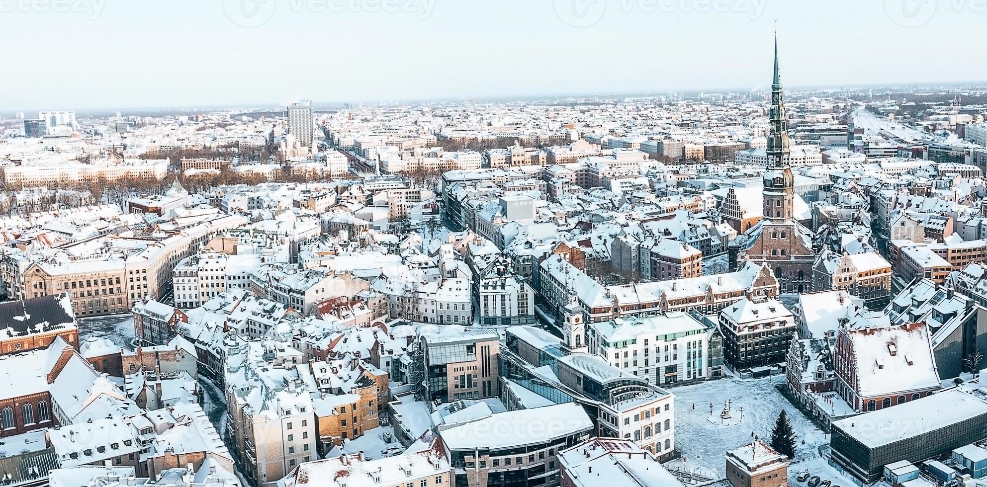 Aerial panorama view of Riga old town during beautiful winter day in Latvia. Freezing temperature in Latvia. White Riga. photo