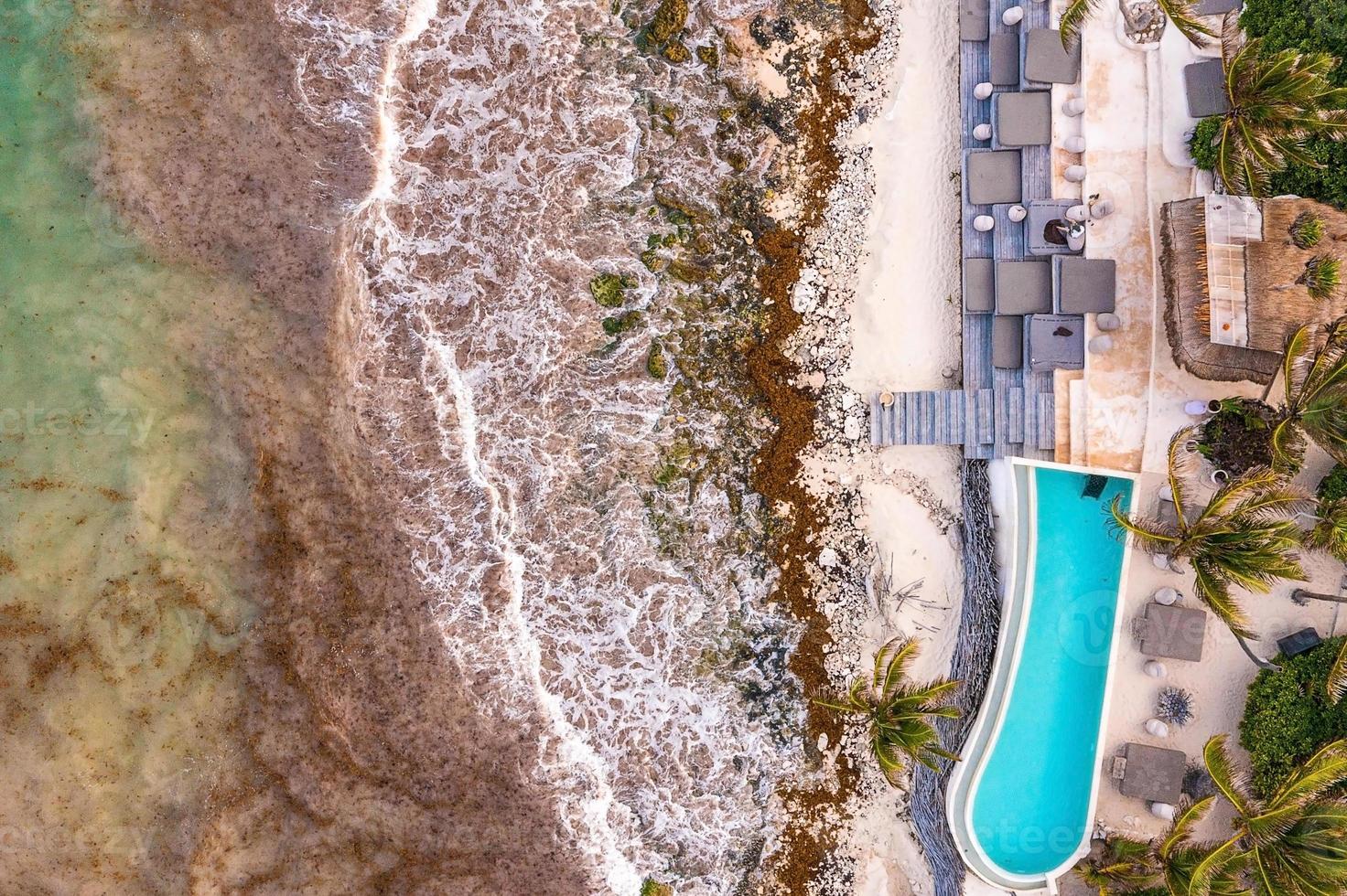 Top view of swimming pool on the cliff edge photo