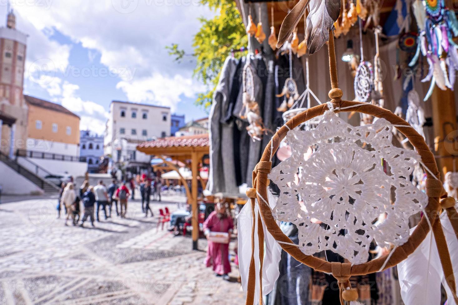 Close up of dream catcher hanging on stall for sale at bazaar photo