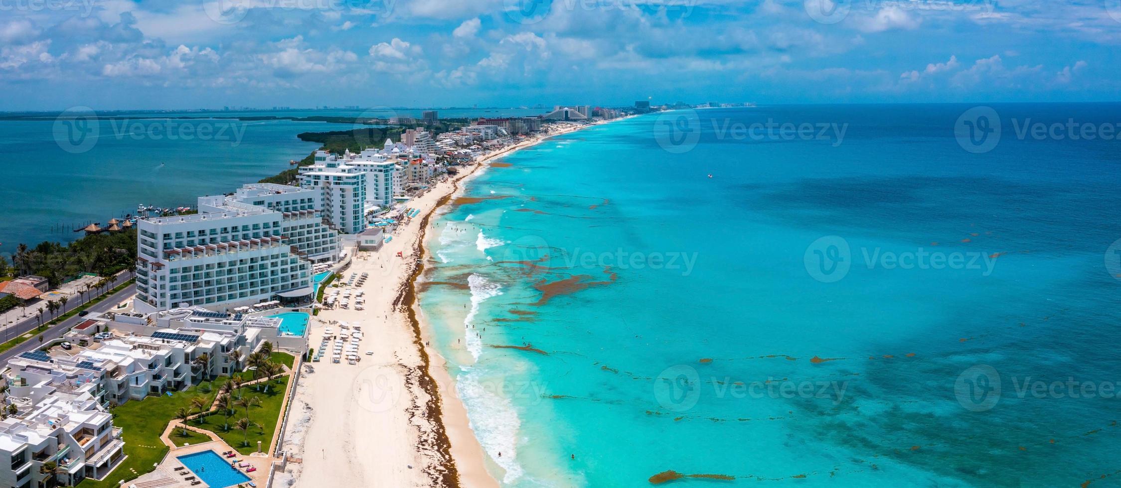 Flying over beautiful Cancun beach area. photo