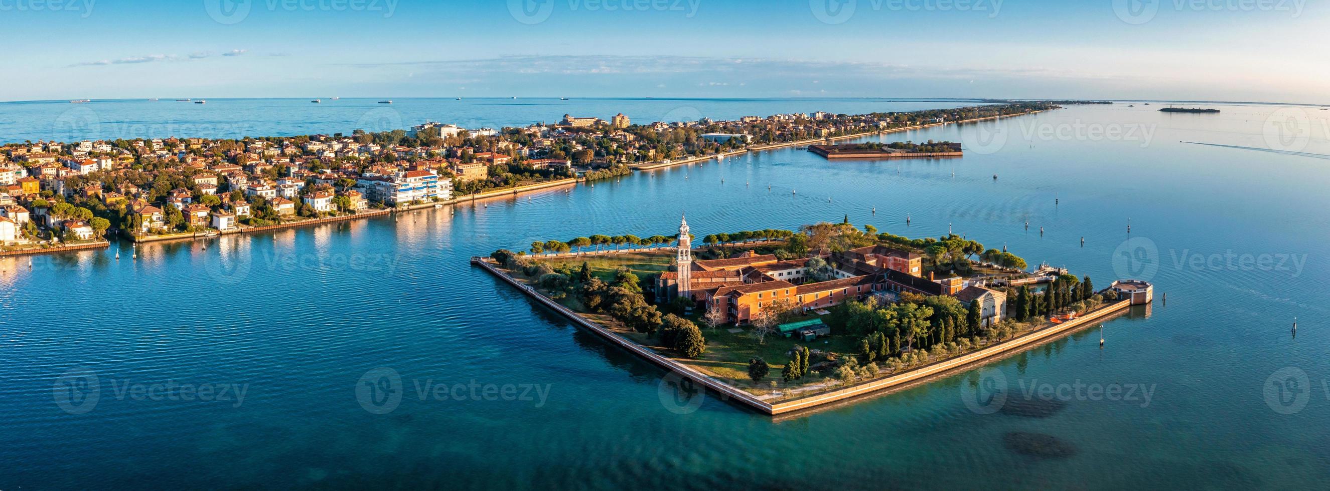 Flying over small Venice islands in Venetian lagoon. photo