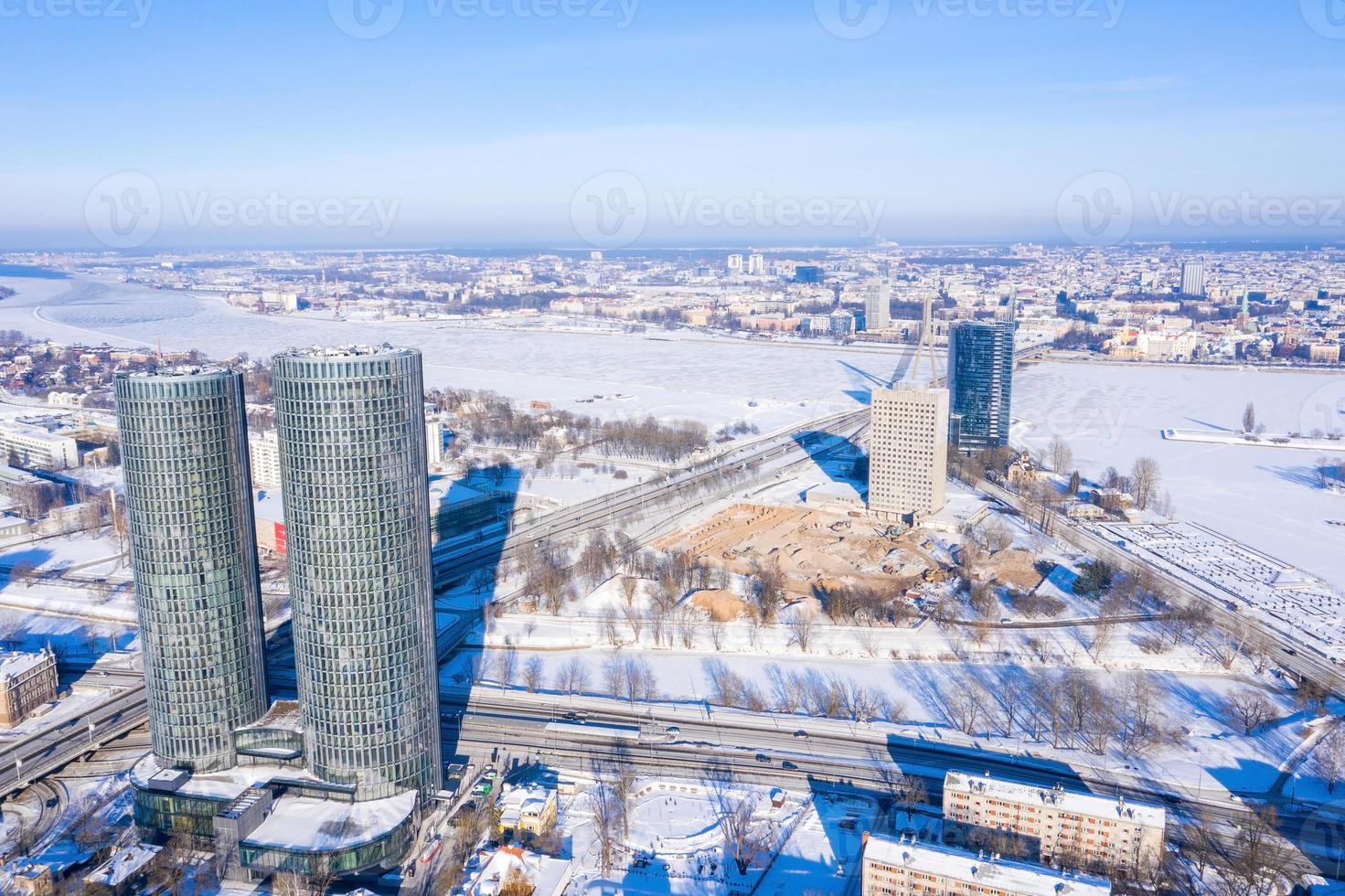 Aerial panoramic view of the Riga city during magical white winter day. Ice old Latvia. photo