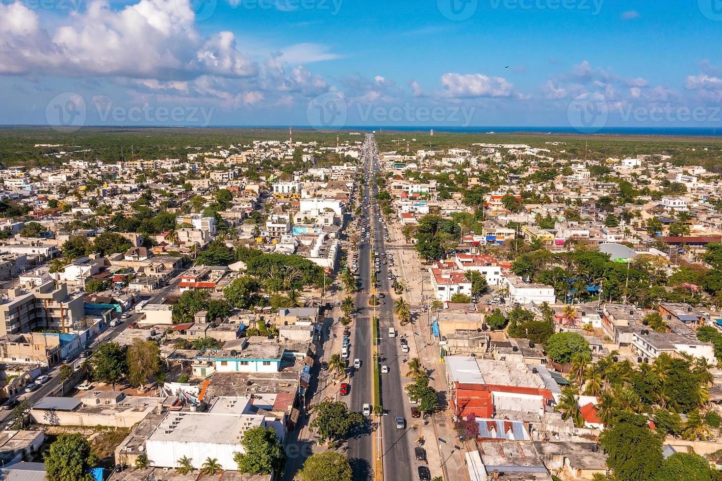 Aerial view of the street intersection with cars driving down the road. photo