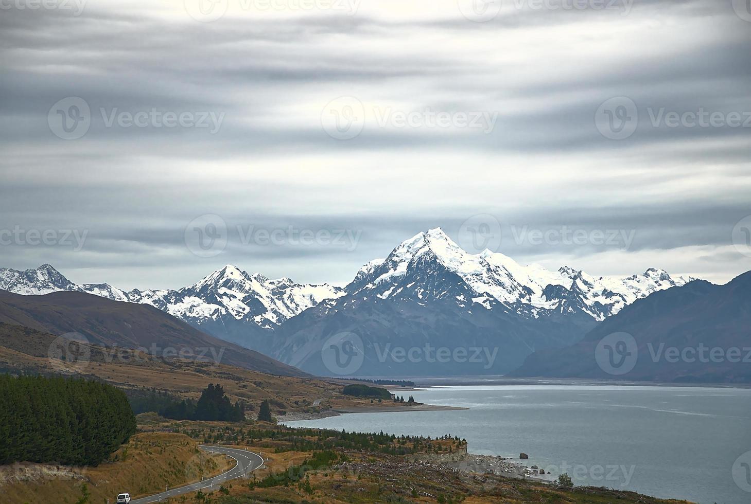 view of a road to MT Cook at Lake Pukaki on a cloudy day of winter photo
