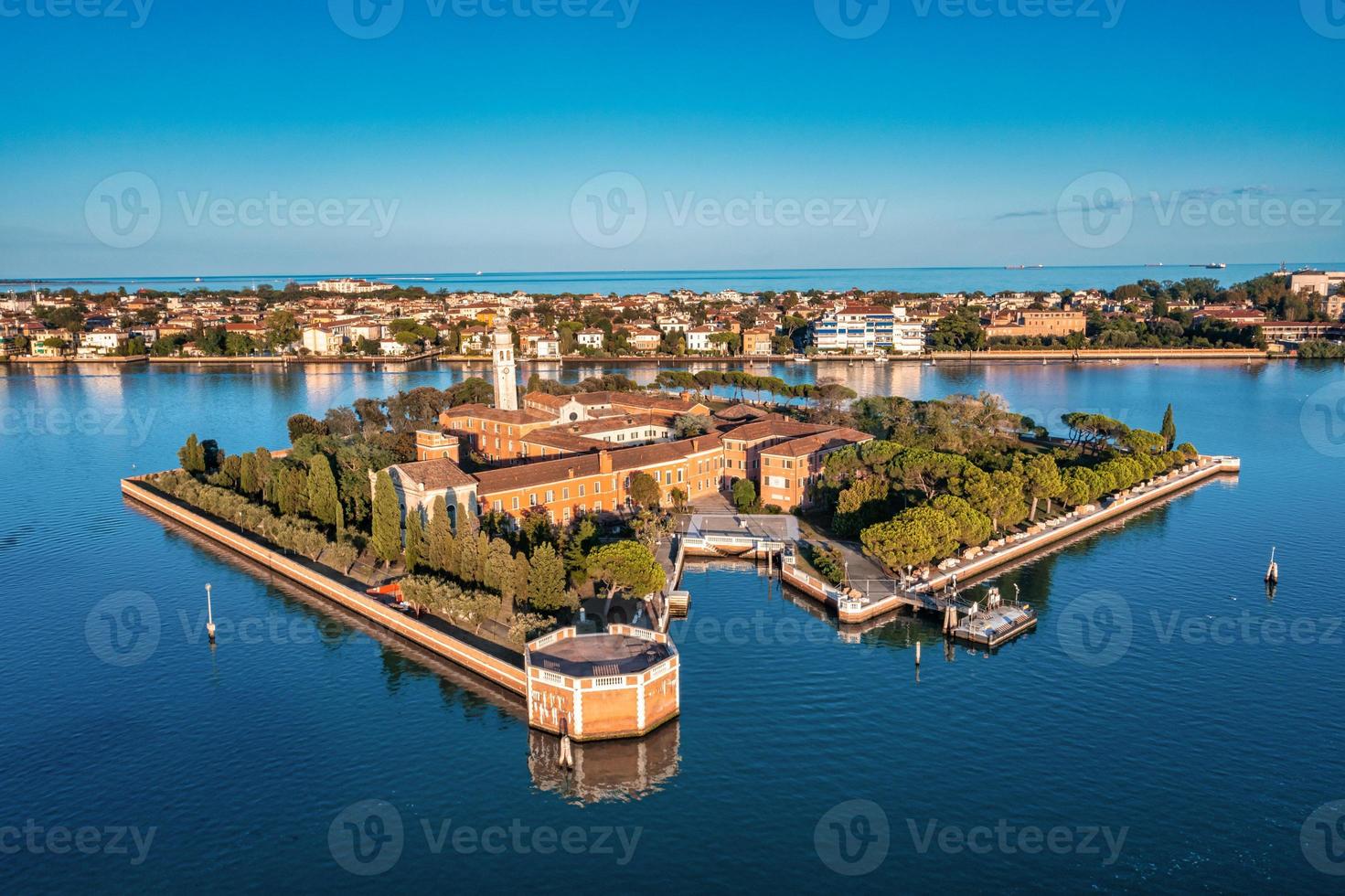 Flying over small Venice islands in Venetian lagoon. photo