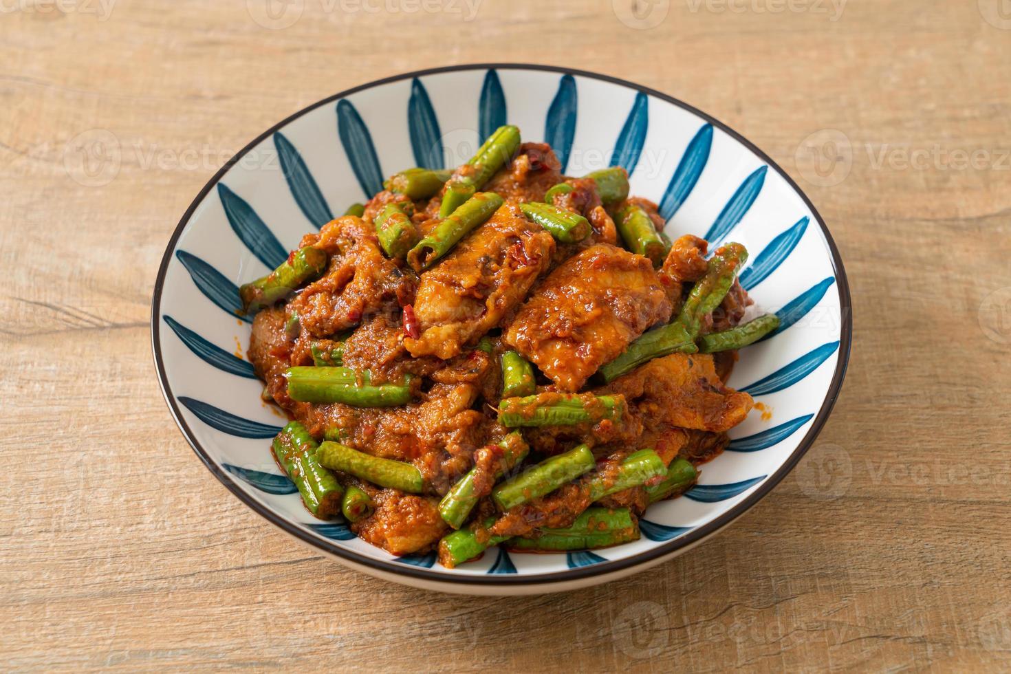 Stir fried pork with red curry paste photo