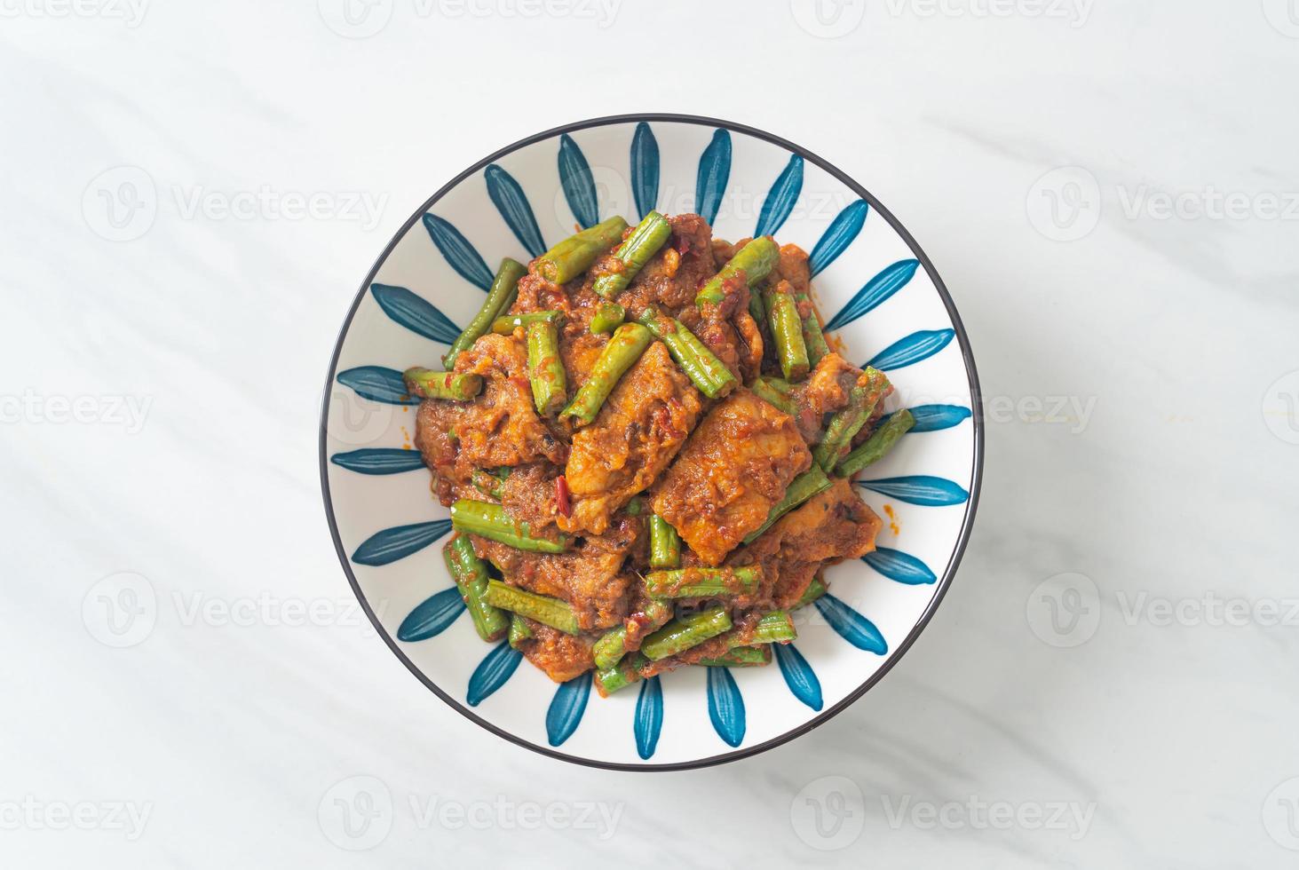 Stir fried pork with red curry paste photo