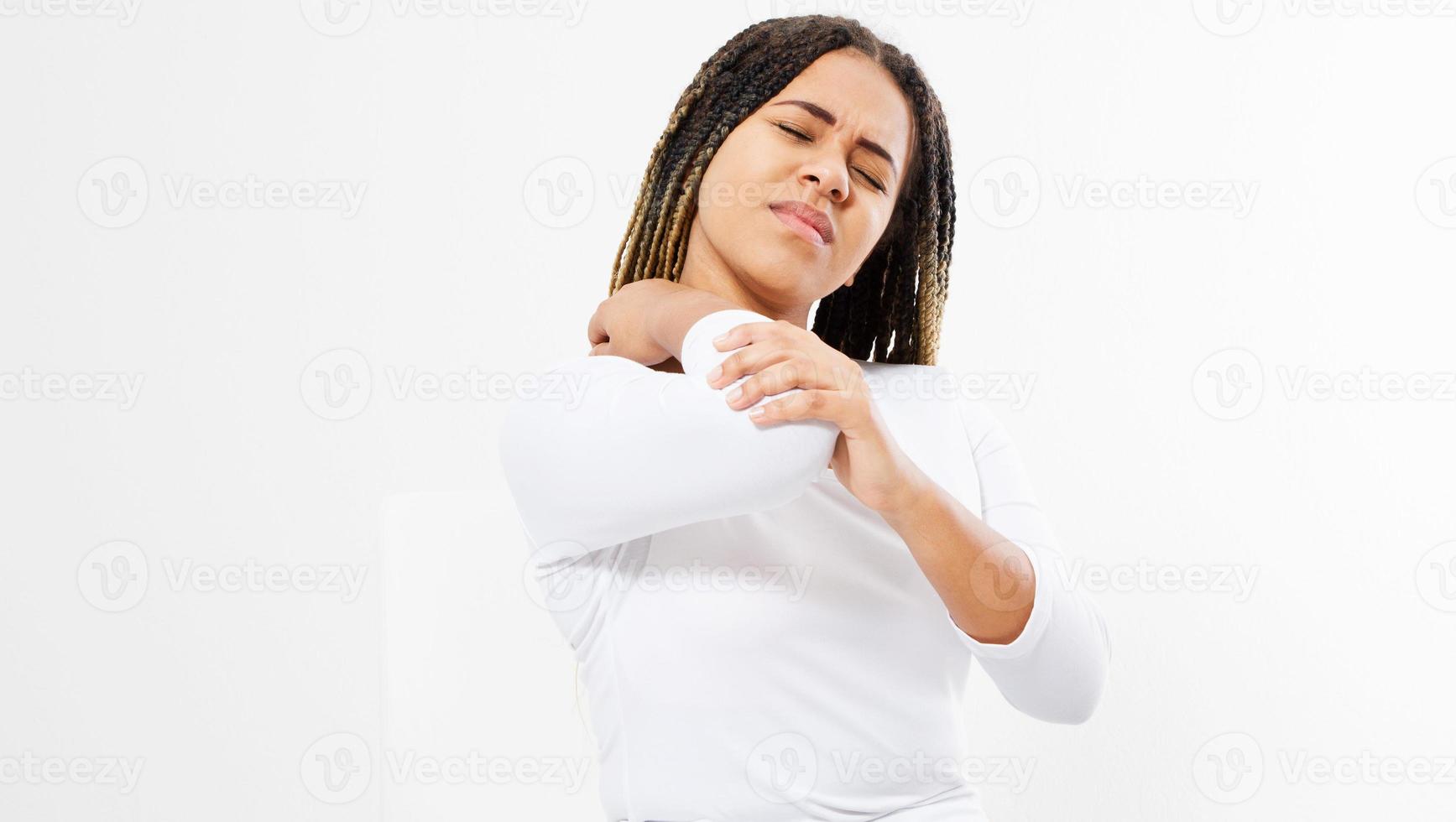 portrait of black Woman suffering from chronic joint rheumatism. Elbow pain and treatment concept photo