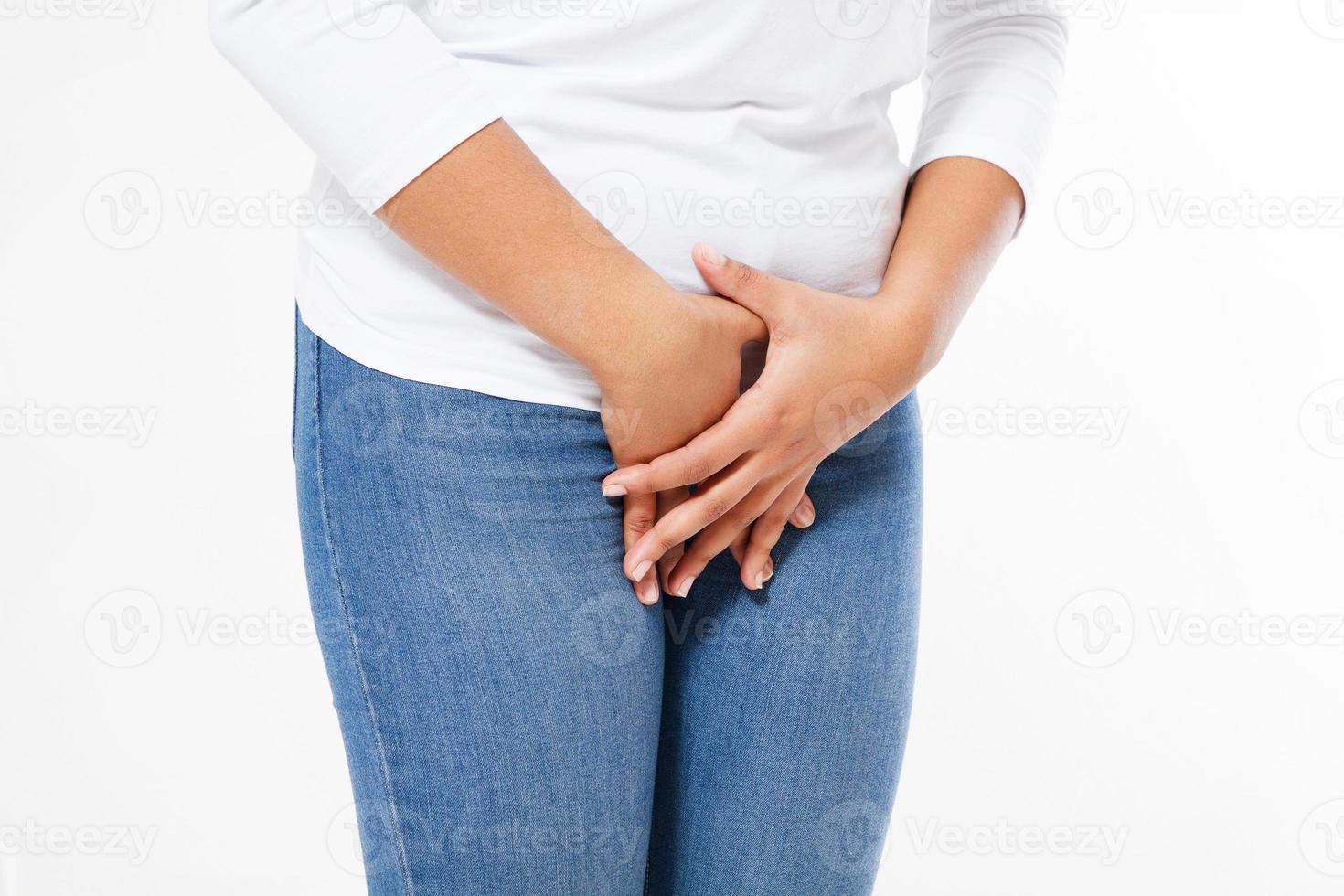 Young sick black woman with hands holding pressing her crotch lower abdomen. Medical or gynecological problems concept photo