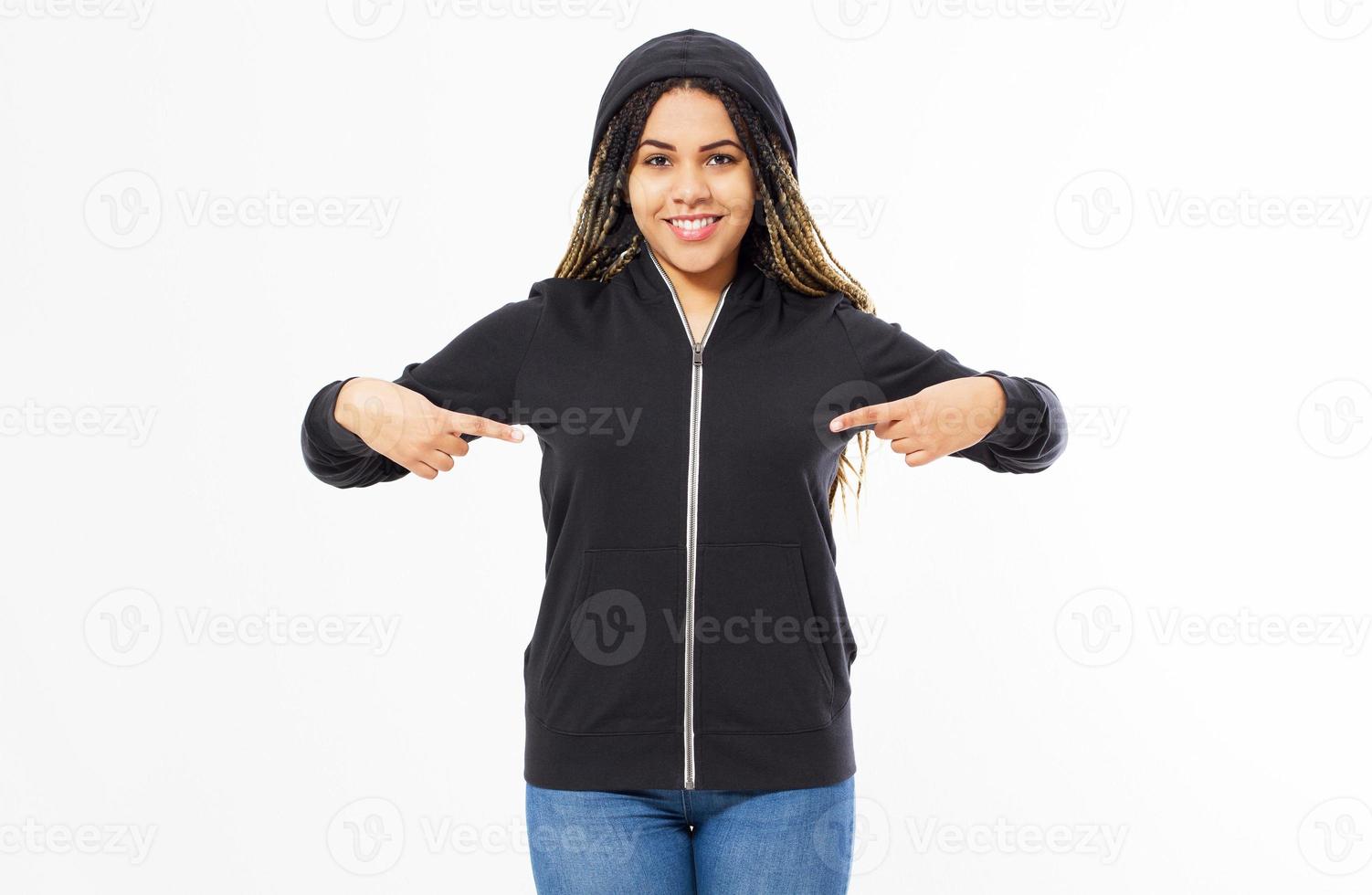 Afro american woman in black hoodie pointing with both hands at it, girl in sweatshirt mock up photo