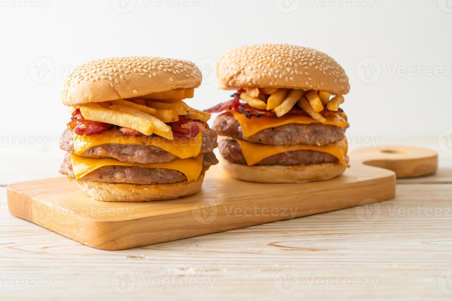 pork burger with cheese, bacon and french fries photo