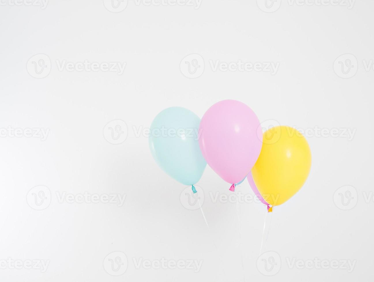 Colorful party balloons background. Isolated on white. Copy space photo