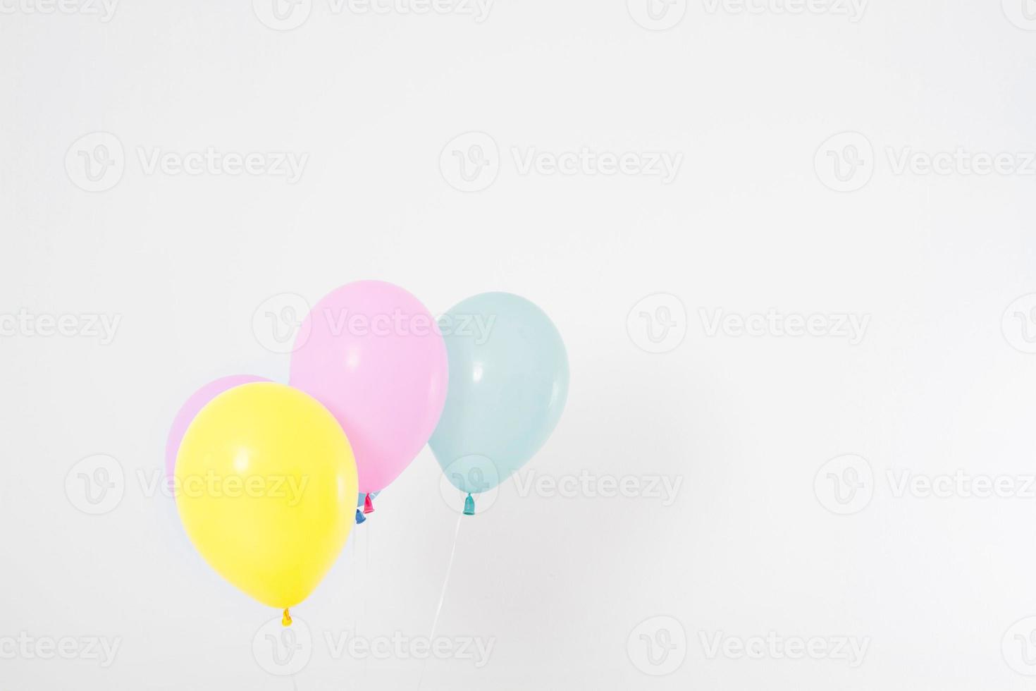 Colorful party balloons background. Isolated on white. Copy space photo