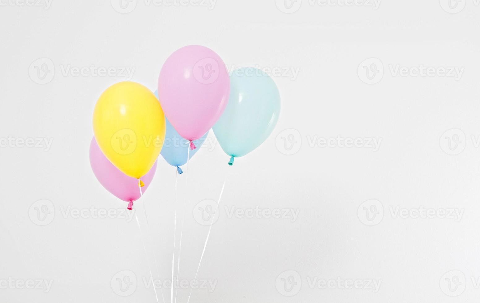 Colorful party balloons background. Isolated on white. Copy space photo