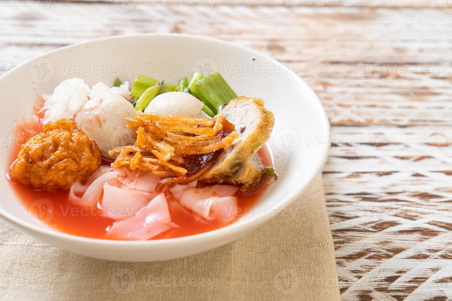 Thai Style Noodle with assorted tofu and fish ball in Red Soup photo