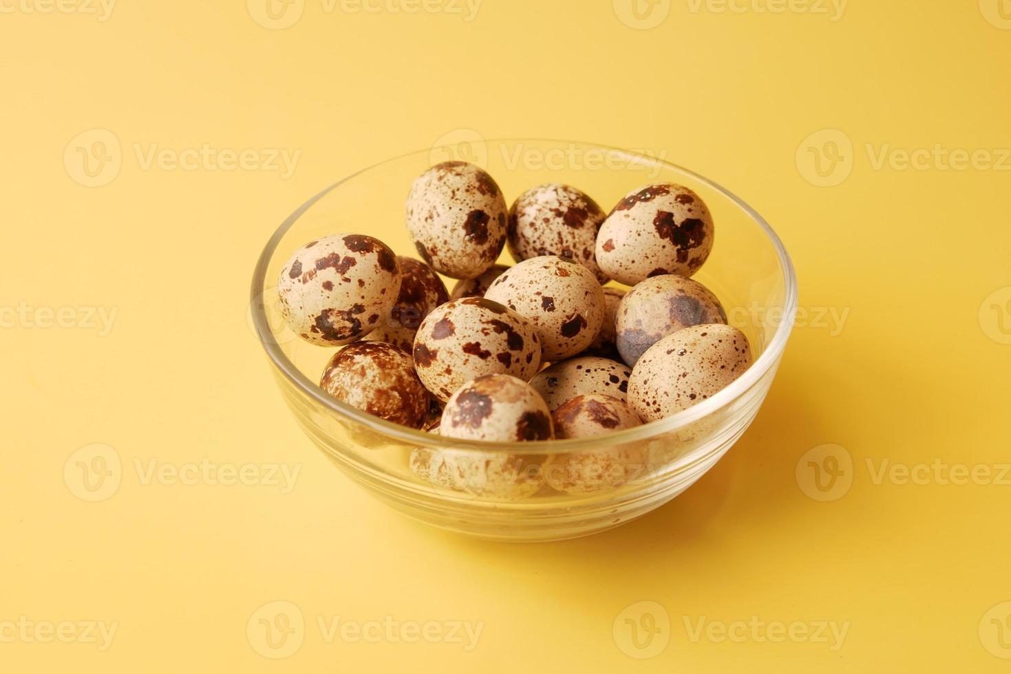 close up of Quails eggs in a box photo