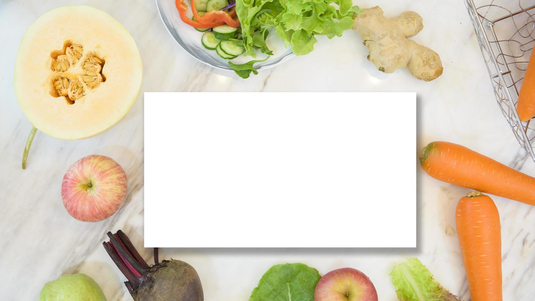 various fruits and vegetables with white paper card. Flat lay. Healthy eating concept. photo