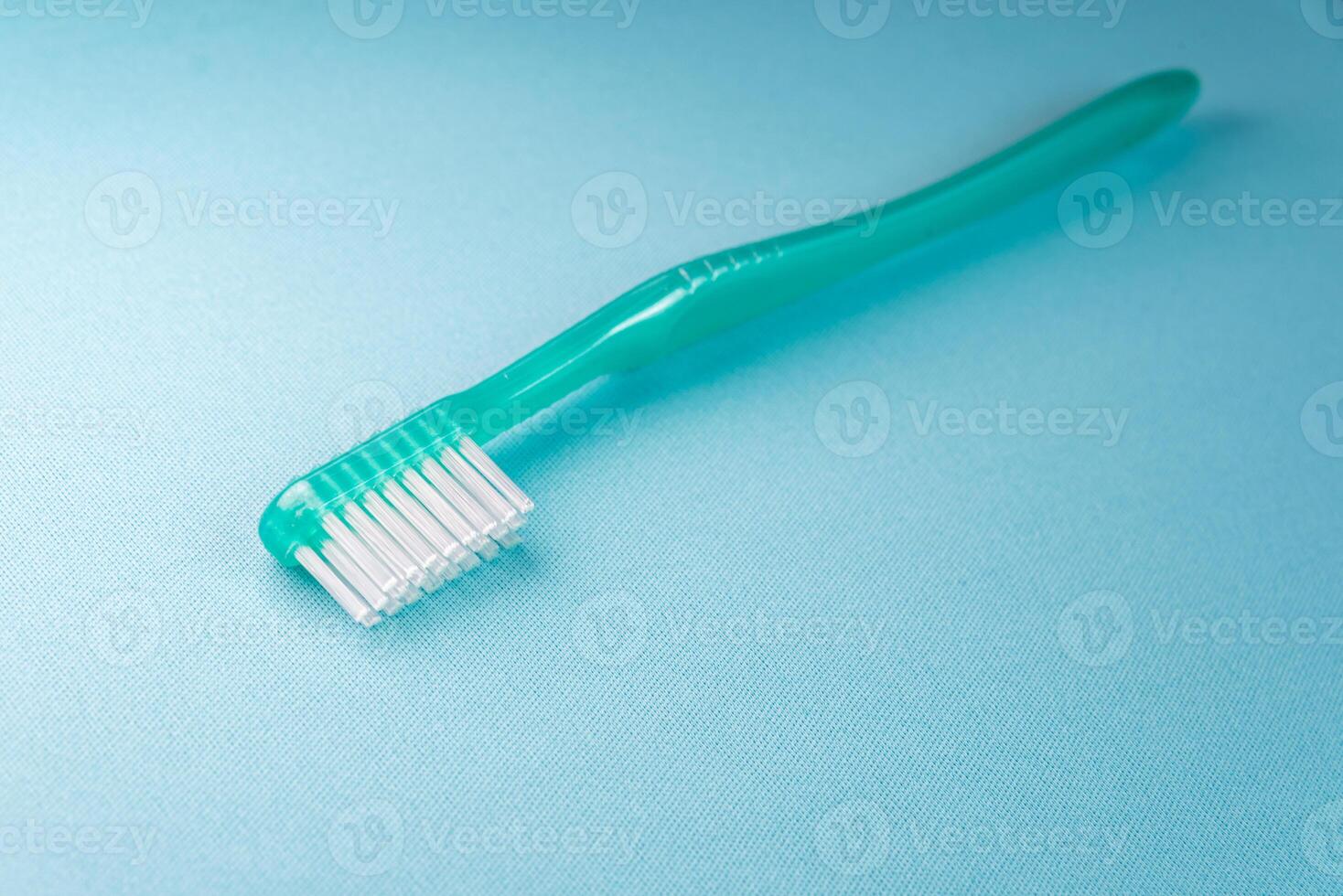 Green toothbrush on the blue background 5138885 Stock Photo at Vecteezy