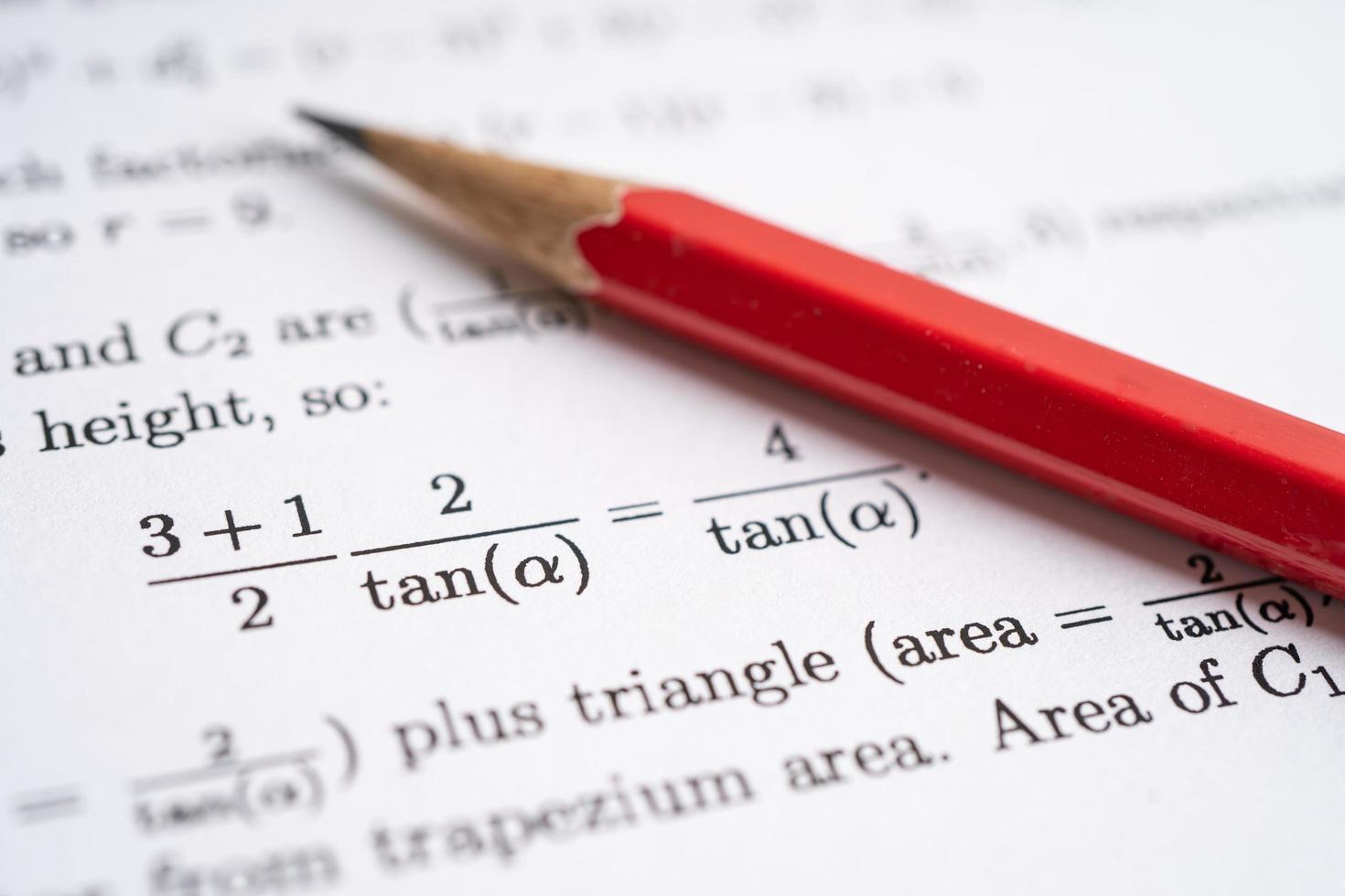 Pencil on mathematic formula exercise test paper in education school. photo