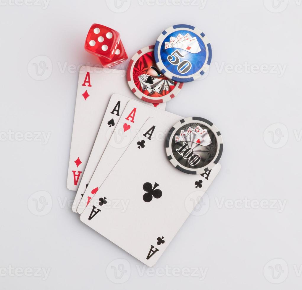 Poker chips, cards and dice on a white background. The concept of gambling and entertainment. Casino and poker photo