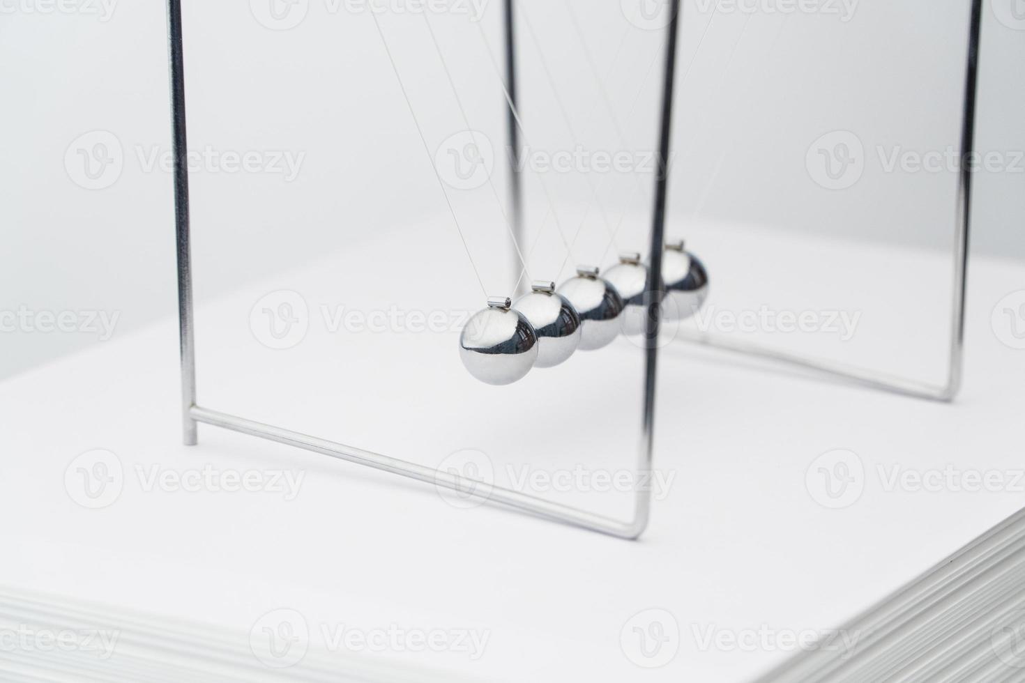 balancing balls pack of sheets of paper. business concept. Newtons Cradle photo